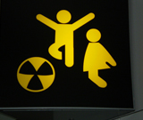 Children playing with ball, ball looks like radiation warning funny road sign